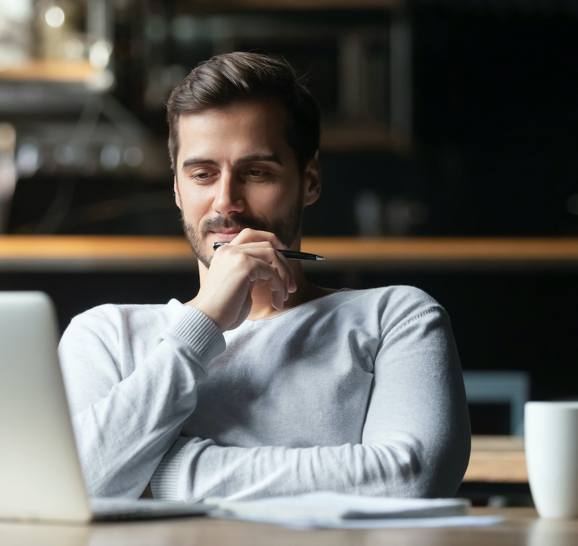 person working at laptop in office