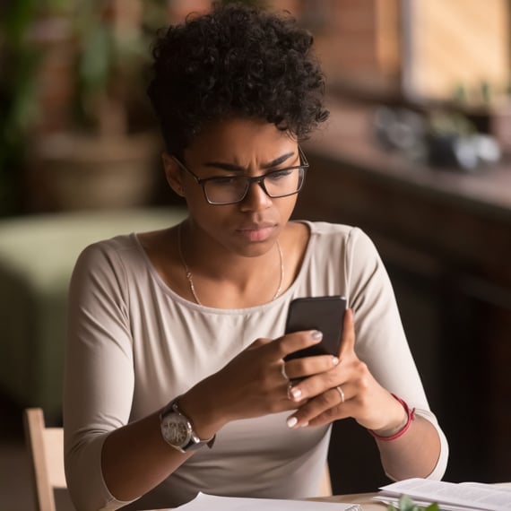 woman working on smartphone